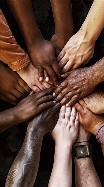 Diverse hands coming together symbolizing unity and community